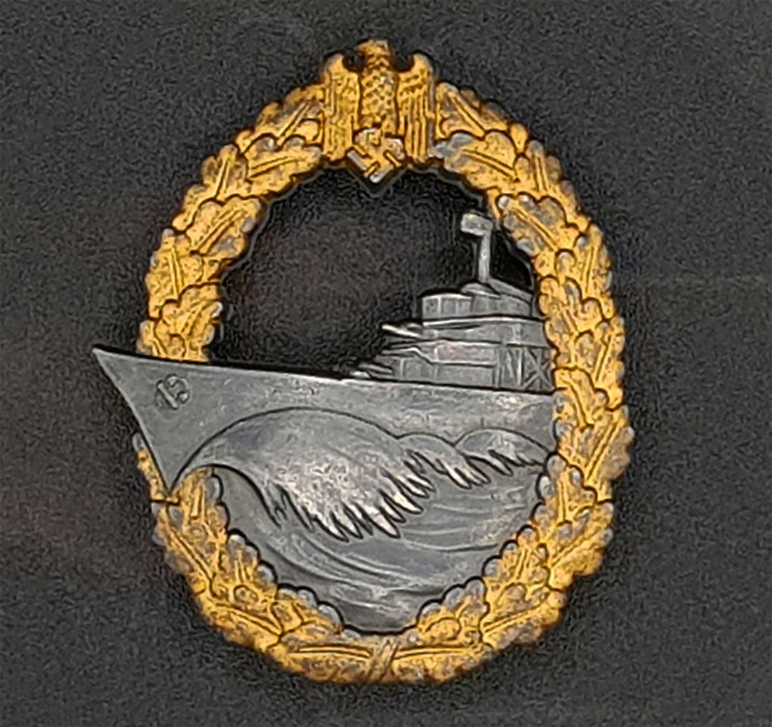 GERMAN WWII KRIEGSMARINE DESTROYER BADGE: GERMAN WWII NAVY KRIEGSMARINE DESTROYER WAR BADGE German WWII Kriegsmarine destroyer war badge produced from 1942 to 1945 with a horizontal pin back. HALLMARKS: Has a maker mark 'f.o'. for Friederich 