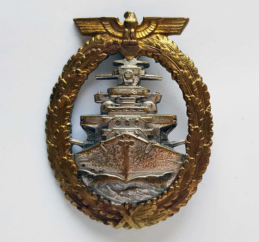 GERMAN WWII KRIEGSMARINE HIGH SEAS FLEET BADGE: GERMAN WWII KRIEGSMARINE HIGH SEAS FLEET BADGE German WWII Kriegsmarine High Seas Fleet badge, made of tombak and produced from 1942 to 1945. It bears the maker's mark 'FEC ADOLF BOCK AUSF SCHWERIN BE