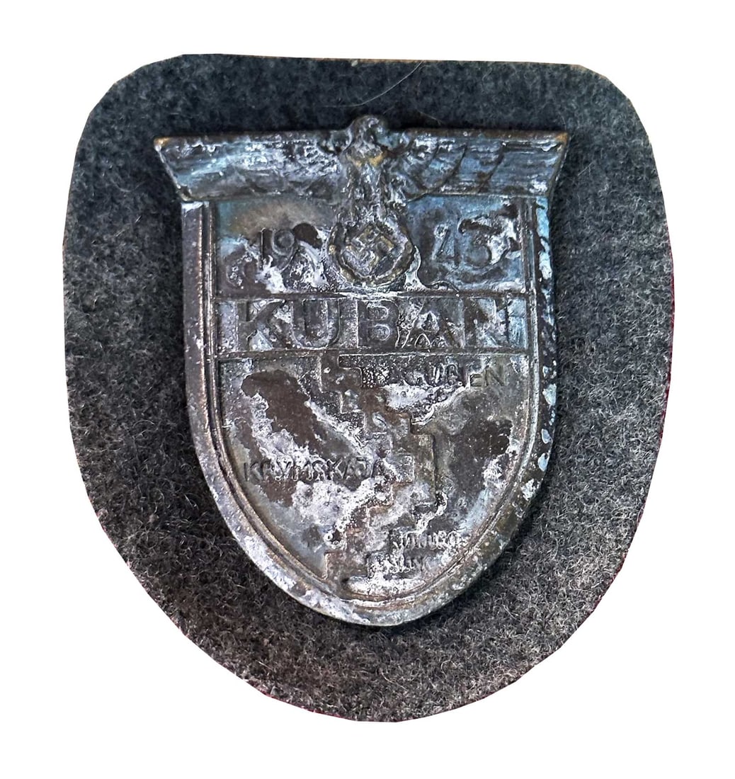 GERMAN WWII KUBAN SLEEVE SHIELD, 1943: GERMAN WWII ARMY KUBAN SLEEVE SHIELD MADE by JOSEF FELIX SOHNE, STAMPED, 1943 Rare WWII German Army 1943 Kuban Sleeve Shield. The front of the patch reads '1943 Kuban Lagunen Krymskata'. It is mounted