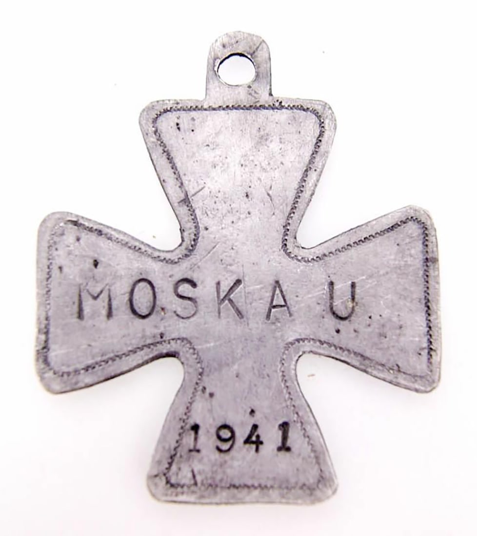 GERMAN WWII IRON CROSS w. MOSKAU, 1941: GERMAN WWII IRON CROSS with ISCRIPTION "MOSKAU", 1941 German WWII Iron Cross with the inscription "Moskau," 1941. This trench art item was discovered on the battlefield in Kurland within German positi