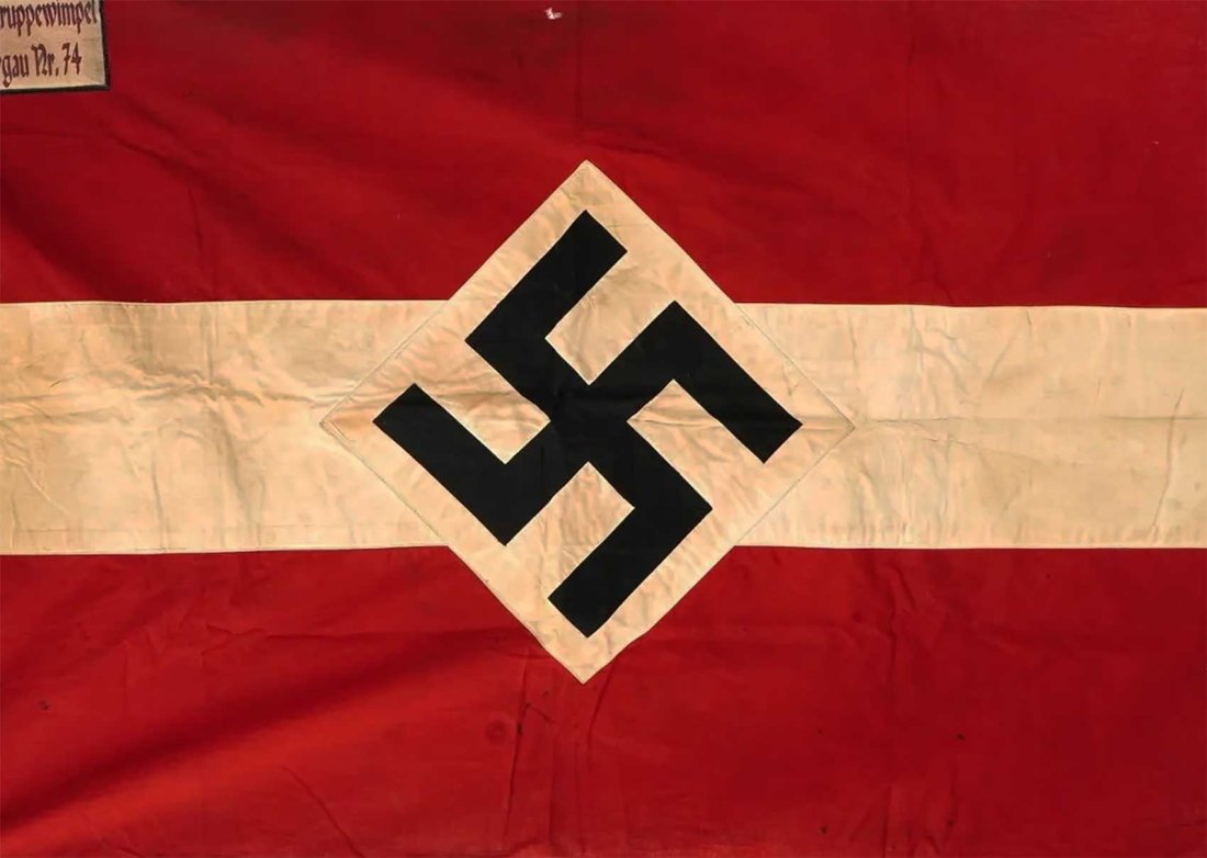 GERMAN WWII HITLER YOUTH BANNER w. TAGS: GERMAN WWII HITLER YOUTH BANNER with TAGS Presented is a WWII Nazi German Third Reich Hitler Youth flag in red, black, and white cotton, featuring a swastika insignia. This banner, approved by the Rei