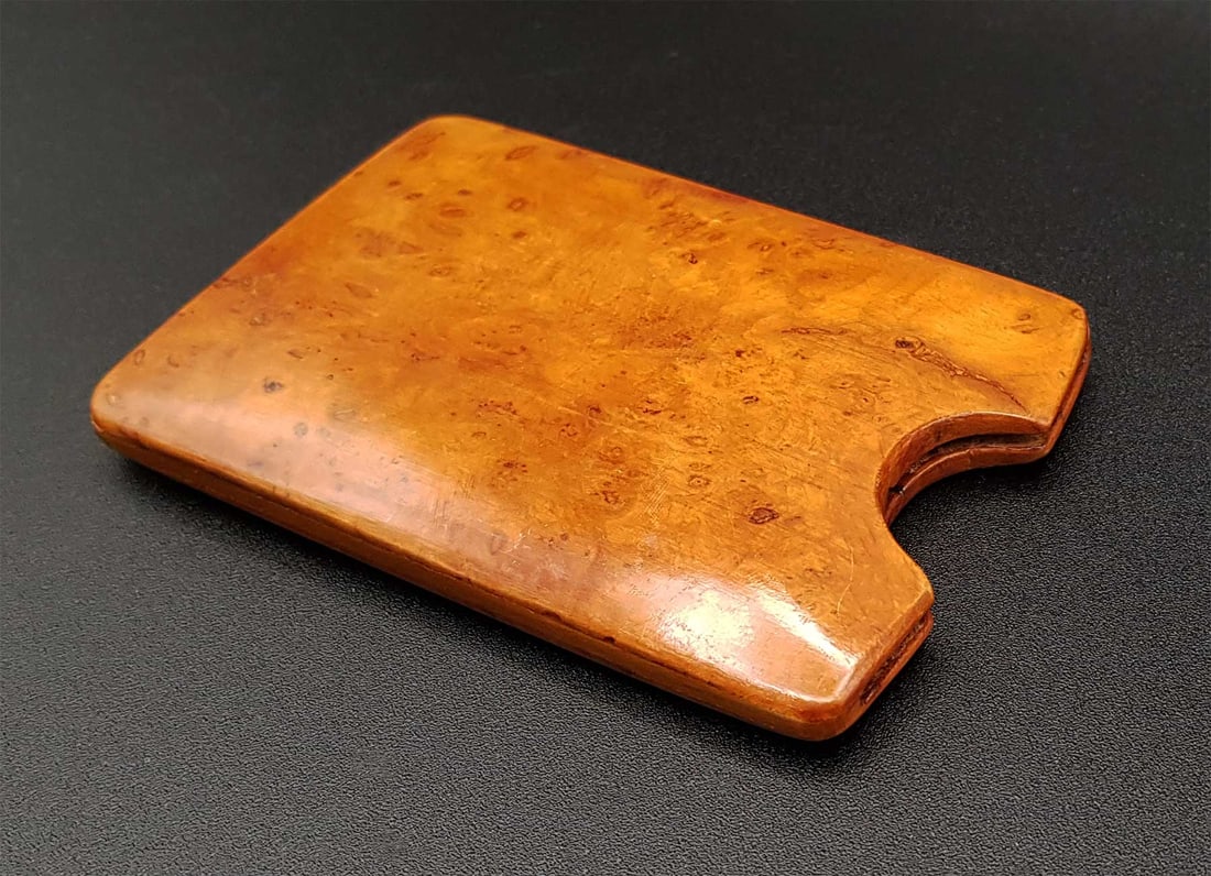 RUSSIAN KARELIAN BIRCH DANCE CARD HOLDER: RARE RUSSIAN KARELIAN BIRCH DANCE CARD HOLDER A rare Russian Karelian birch wood card holder, often used as a holder for the dance card. CONDITION: In very good condition considering its age, with no 