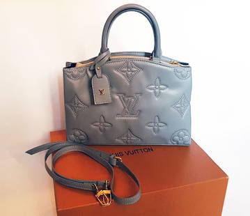 LOUIS VUITTON COUSSIN MONOGRAM BAG GREY: LOUIS VUITTON COUSSIN MONOGRAM EMBOSSED LEATHER SHOULDER BAG GREY Louis Vuitton luxurious crossbody bag for every occasion. The bag can be worn across the body or draped gracefully over the shoulder o