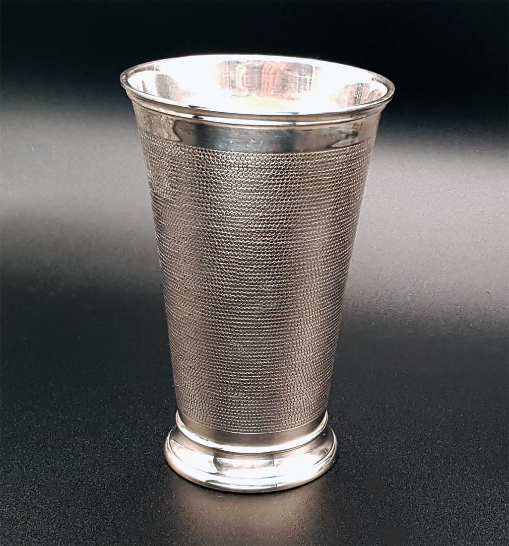 JUDAICA SILVER KIDDUSH BEAKER SNAKESKIN: JUDAICA STERLING SILVER SNAKESKIN KIDDUSH BEAKER Judaica sterling silver SnakeSkin kiddush beaker by Odiot. HALLMARKS: 'ODIOT' and other marks. CONDITION: The item is in very good, used condition. For