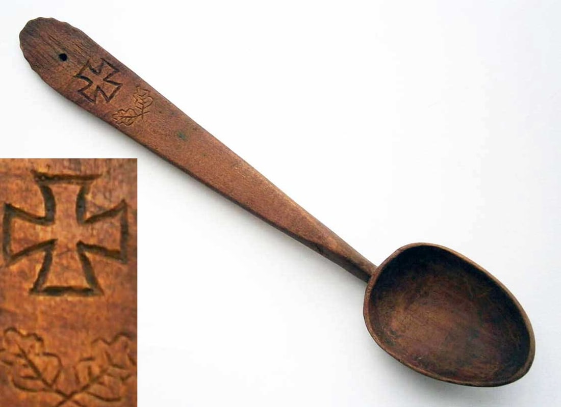GERMAN WWII SPOON w. IRON CROSS & OAK LEAVES: Sale - Must Go ! GERMAN WWII SPOON with IRON CROSS and OAK LEAVES, 1941-1945 This is a German WWII spoon adorned with an Iron Cross and oak leaves, showcasing trench art and wood carving. It originate
