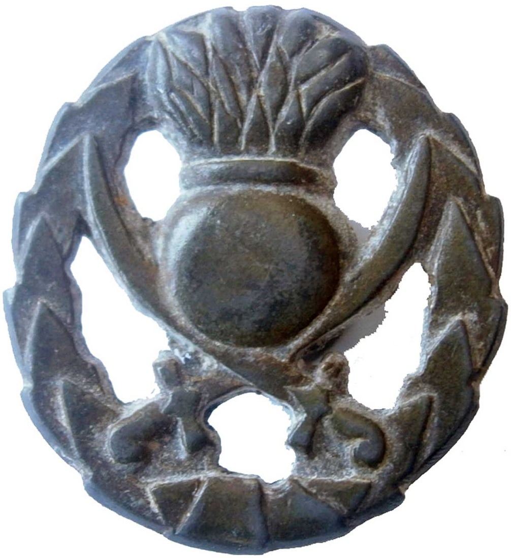 GERMAN WWII BADGE w. GRENADE & TWO SABRES: Sale - Must Go! GERMAN WWII BADGE with GRENADE and TWO SABRES German WWII Badge with Grenade and Two Sabres: This type of badge was used by Russian Cossacks in the German Army, making it a very collec