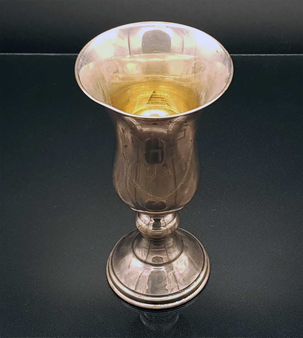JEWISH SILVER KIDDUSH CUP, JUDAICA: Great Display Piece! With Huge Historical Value! JEWISH SILVER KIDDUSH CUP, JUDAICA This silver kiddush cup features a graduating body and is adorned with engraved Hebrew letters enclosed within a dec