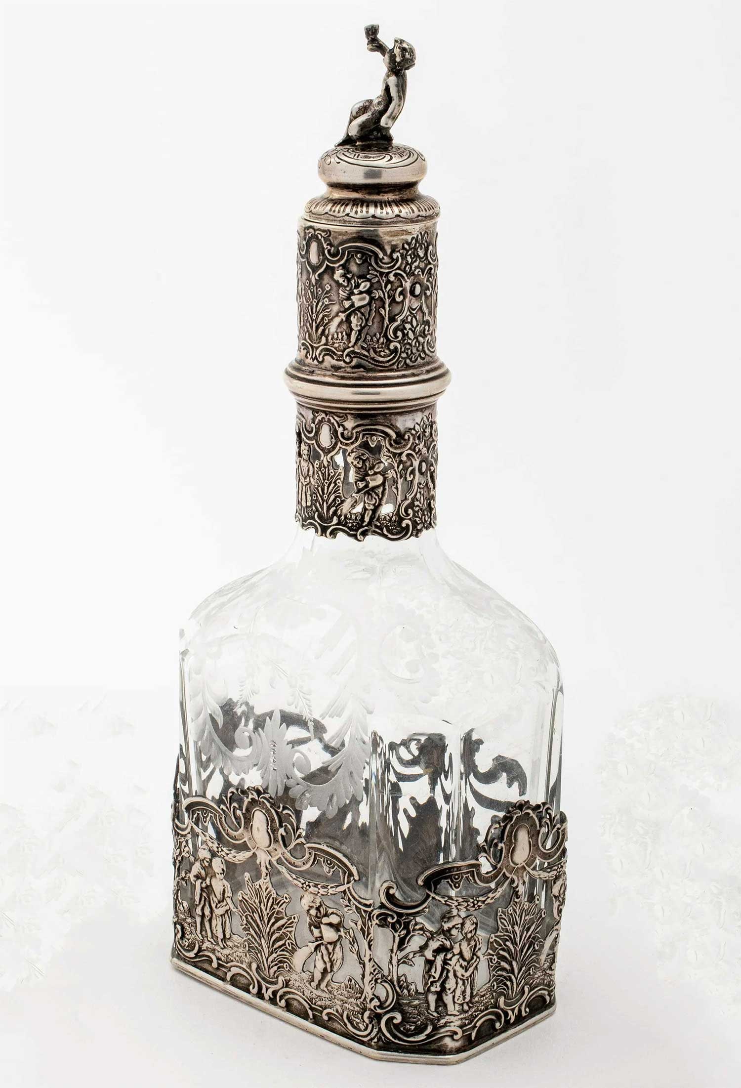 GERMAN SILVER OVERLAY DECANTER, STORCK & SINSHEIMER: LifeTime Warranty! Price Reduced — Limited-Time Offer! GERMAN SILVER OVERLAY DECANTER, STORCK and SINSHEIMER, 19th CENTURY Storck and Sinsheimer (1874-1926) produced this Hanau silver decanter bottl