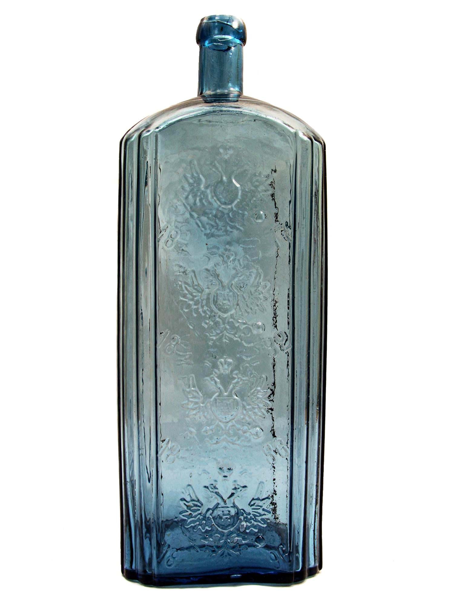 VODKA - LARGE RUSSIAN GLASS BOTTLE, 1896: Flexible Payments: Pay Over 3–6 Months! VODKA - ANTIQUE RUSSIAN VERY LARGE GLASS BOTTLE, 1896 This is a large Russian Empire vodka bottle made from blue glass. The bottle is marked with a text indic
