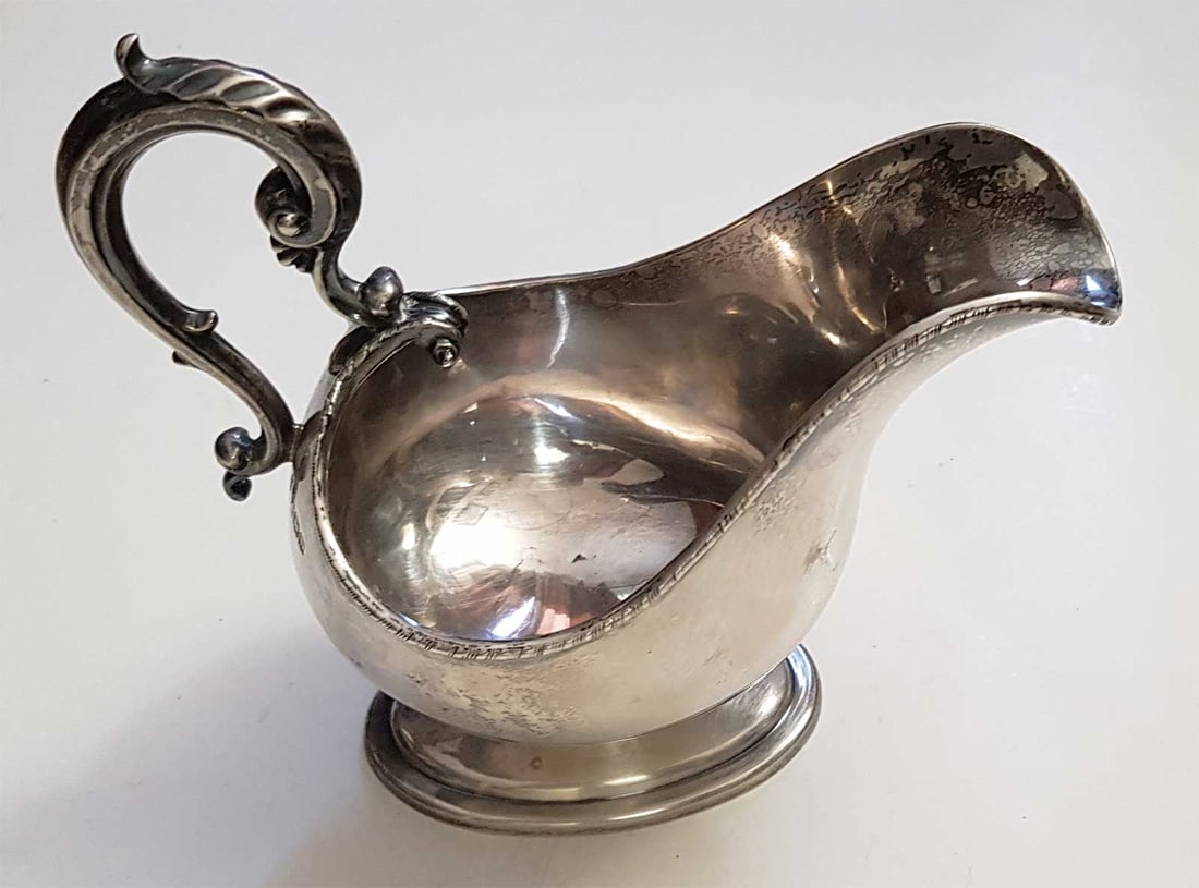 UNUSUAL ANTIQUE SILVER GRAVY BOAT, 1892: LifeTime Warranty! Flexible Payments: Pay Over 3–6 Months! UNUSUAL ANTIQUE ENGLISH STERLING SILVER GRAVY BOAT, 1892 This is an unusual antique English sterling silver gravy boat. This Rare and Highl