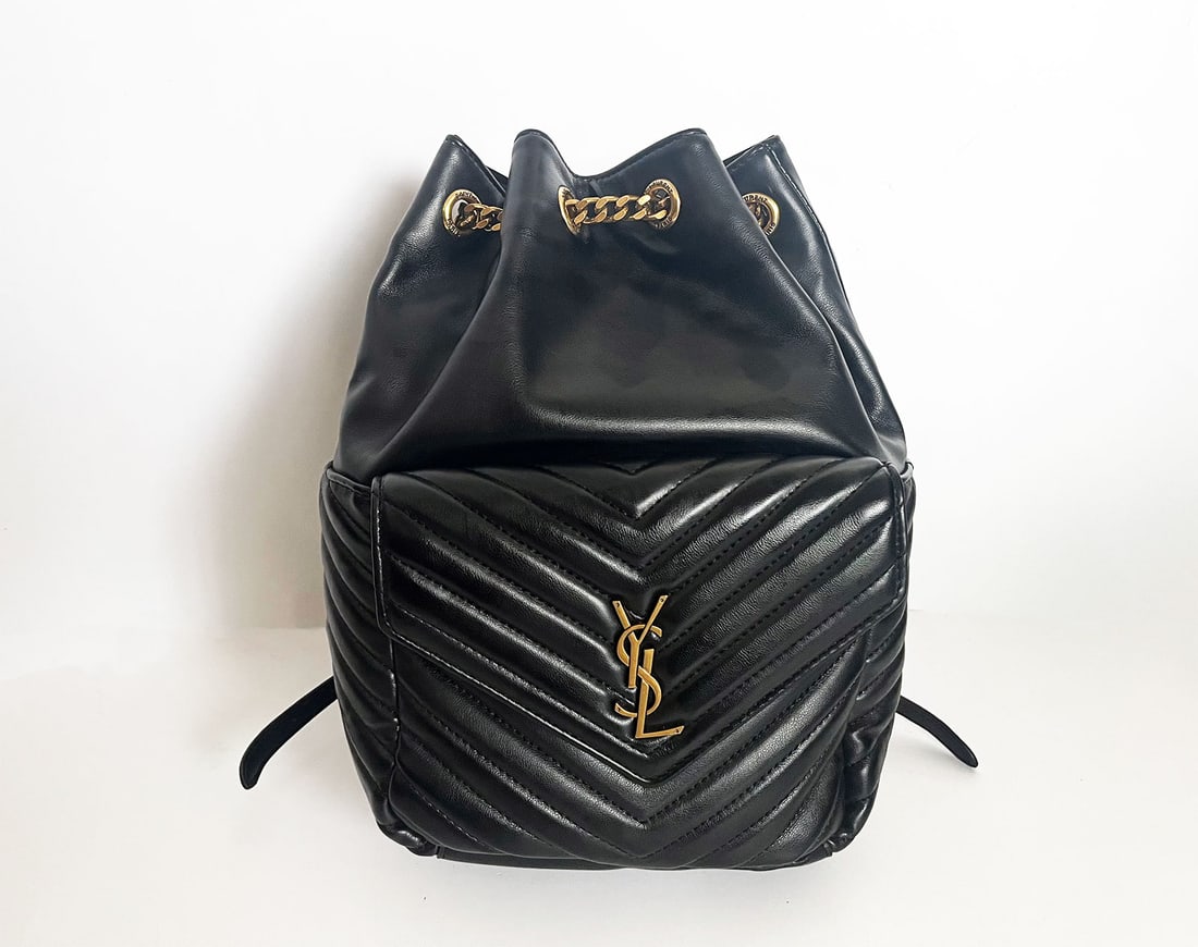 SAINT LAURENT JOE BACKPACK. CODE GUE572609-0721: SAINT LAURENT YSL MONOGRAM JOE BACKPACK IN BLACK LAMBSKIN. CODE GUE572609-0721 Founded in 1961, Saint Laurent is one of the most influential fashion houses of the 20th century. This Pre-owned Saint La