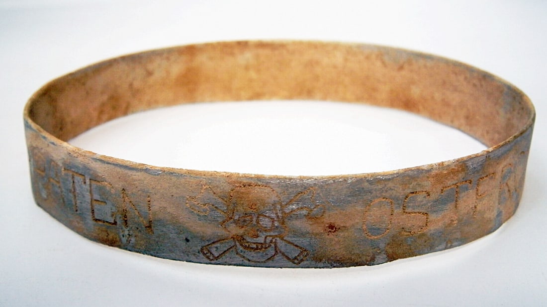 GERMAN WWII BRACELET w. SKULL & BONEs: Display Piece! Price Reduced — Limited-Time Offer! GERMAN WWII BRACELET with SKULL & BONEs, OSTFRONT - TRENCH ART German WWII bracelet featuring a skull and crossbones, with the inscriptions