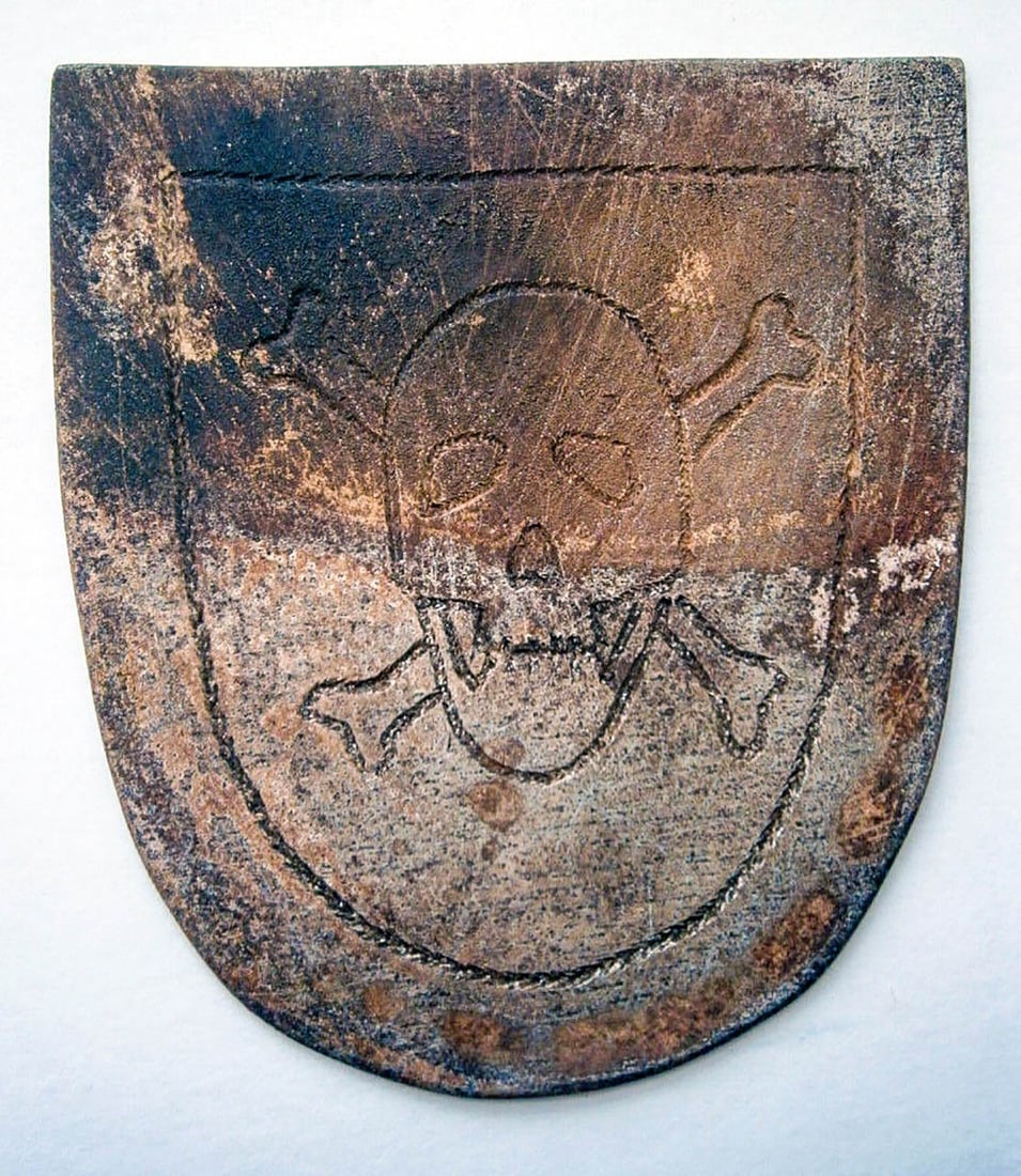 GERMAN WWII SHIELD w. SKULL & BONES, 1941-1945: Display Piece! Price Reduced — Limited-Time Offer! GERMAN WWII SHIELD with SKULL and BONES, 1941-1945, TRENCH ART German WWII shield with a skull and bones motif, crafted from metal and engraved usi