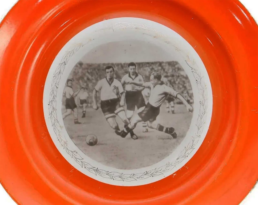 LARGE RUSSIAN PORCELAIN FOOTBALL PLATE, 1959: Prestigious Gift! Price Reduced — Limited-Time Offer! LARGE RARE RUSSIAN SOVIET PORCELAIN FOOTBALL PLATE, 1959 A Russian Soviet porcelain plate, dated 1959, featuring a bright orange border and a ce