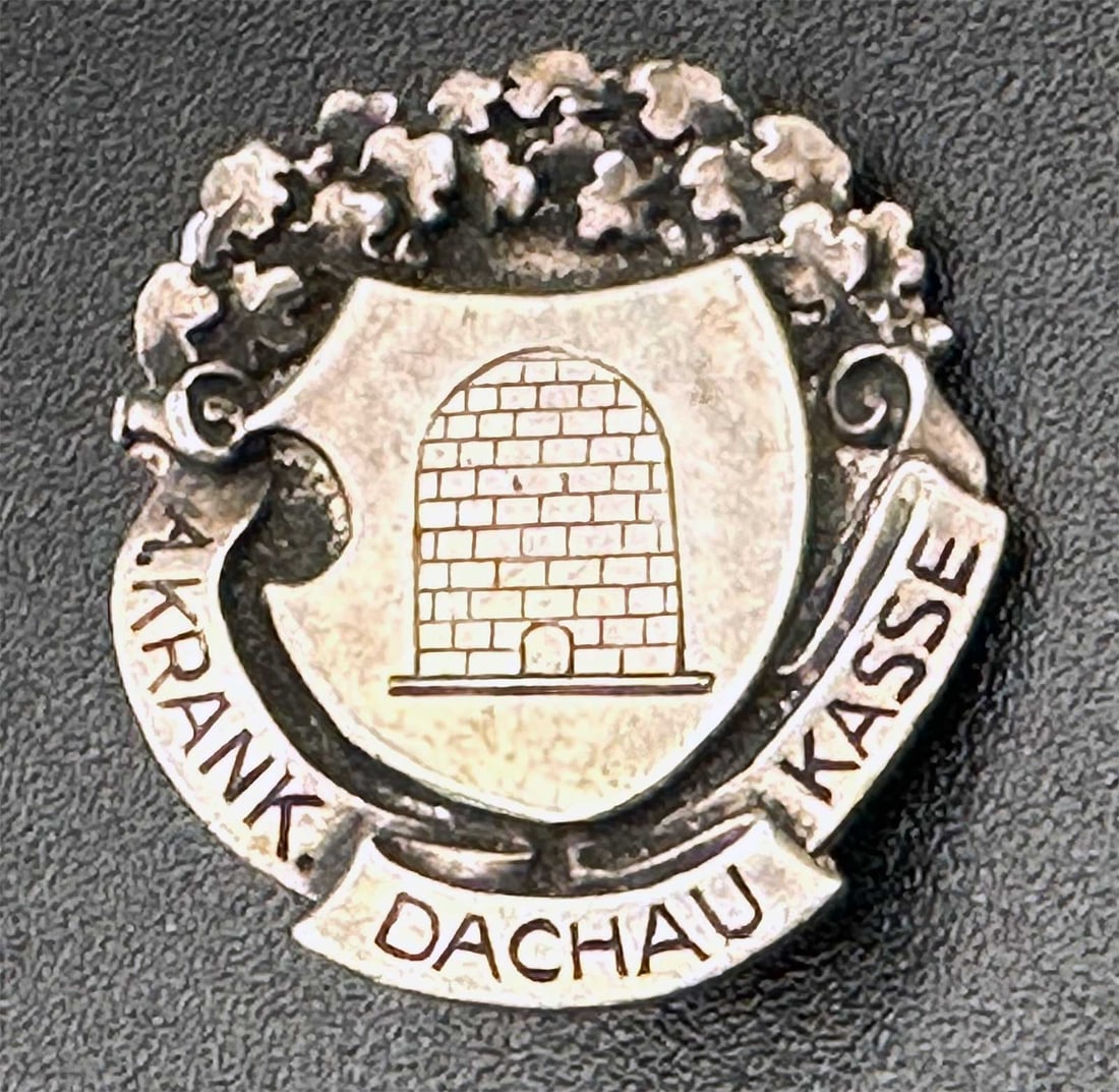 RARE GERMAN WWII DACHAU BADGE DESCHLER MUNCHEN MARKED: No Reserve! Limited-Time Price Reduction! RARE GERMAN WWII DACHAU BADGE DESCHLER MUNCHEN MARKED Presented is a rare German WWII-era Dachau badge featuring the maker's markings "DESCHLER" and "MUNCHEN 