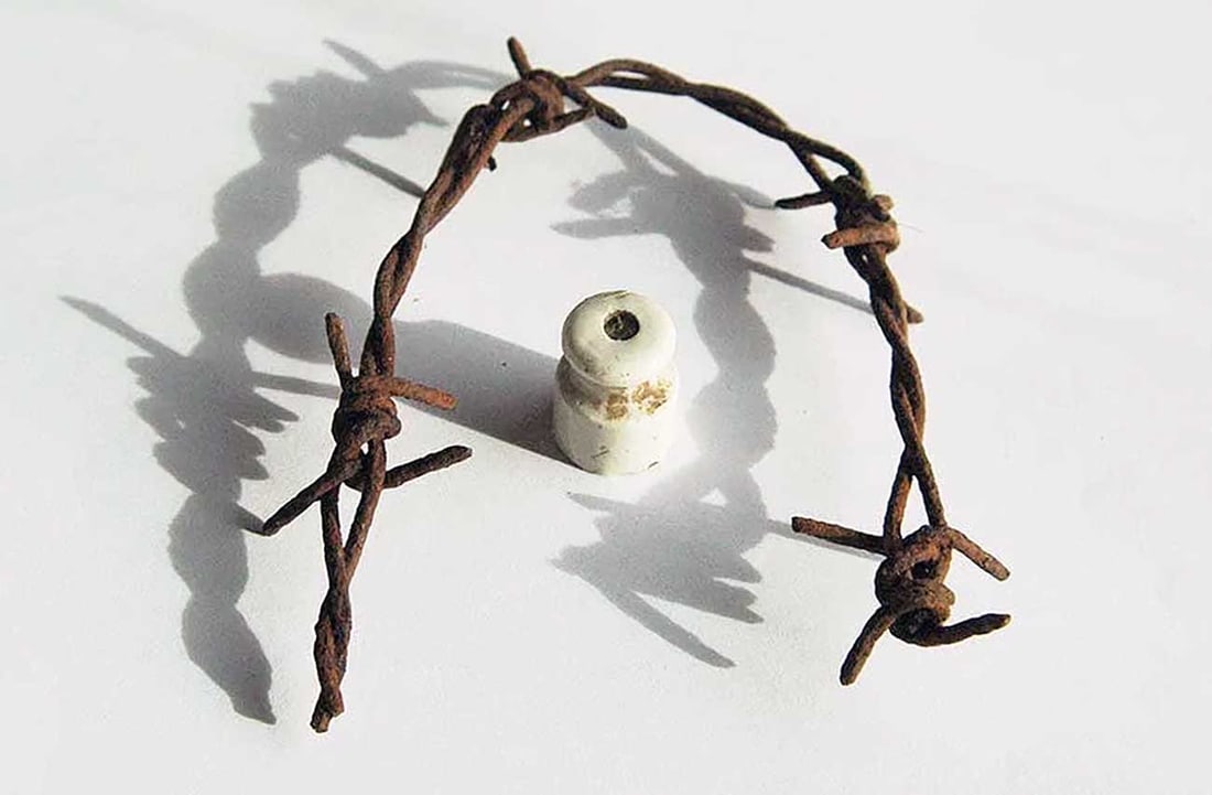 RARE GERMAN WWII KL KZ CONCENTRATION CAMP ELECTRIC FENCE INSULATOR WITH WIRE ARTIFACT: No Reserve! Limited-Time Price Reduction! RARE GERMAN WWII KL KZ CONCENTRATION CAMP ELECTRIC FENCE INSULATOR WITH WIRE ARTIFACT Presented is a rare German WWII electric fence isolator with original wi
