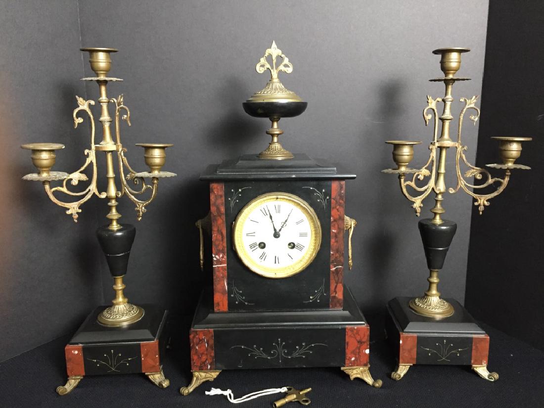 1850's Japy Freres Garniture Set: Dated 1857 from Medallion inside. Clock and pair of candlesticks. Good condition. Not certain if it's working. Clock 17H x 10W x 5D in. Candle Holders 16.50H x 7W x 4.50D