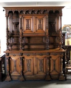 Italian Court Cupboard/Server: 95" High x 78.50" Wide x 23" Deep in three parts .VG Cond. Triple body, four lower doors, four external drawers,two upper doors, Some minor wear to surface. repair needed to one lion face and 4 small 