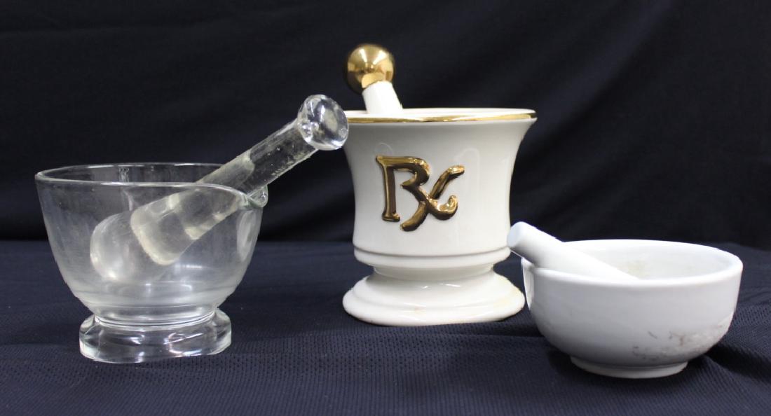 (3) Mortar & Pestles: Lot of three sets/ mortar & pestles. Good condition with minimal wear. No damage noted. 2"-6" tallWhite & GoldClear GlassSmall White