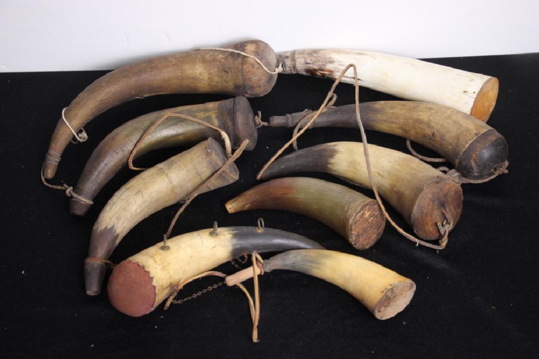 Grouping of Powder Horns: 9 antique and vintage powder horns in good condition. Ranges in size from 7 to 11.5 inches long. Goldfinch Auctions can ship this lot in-house.