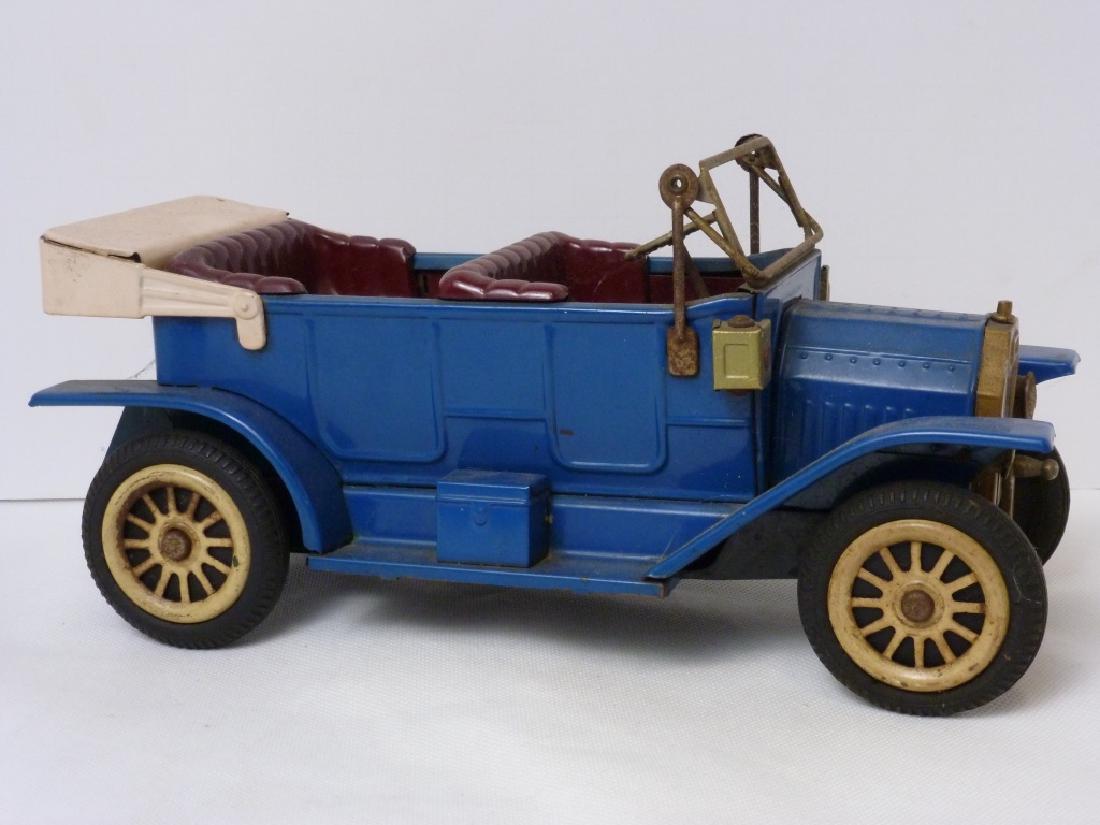 Ford 1908 Model T Friction Powered Made in Japan: F1908 Tin Litho Ford 1908 Model T Friction-Powered Push Toy Car Made in Japan. 4 h x 9.5 w x 4 d inches.
