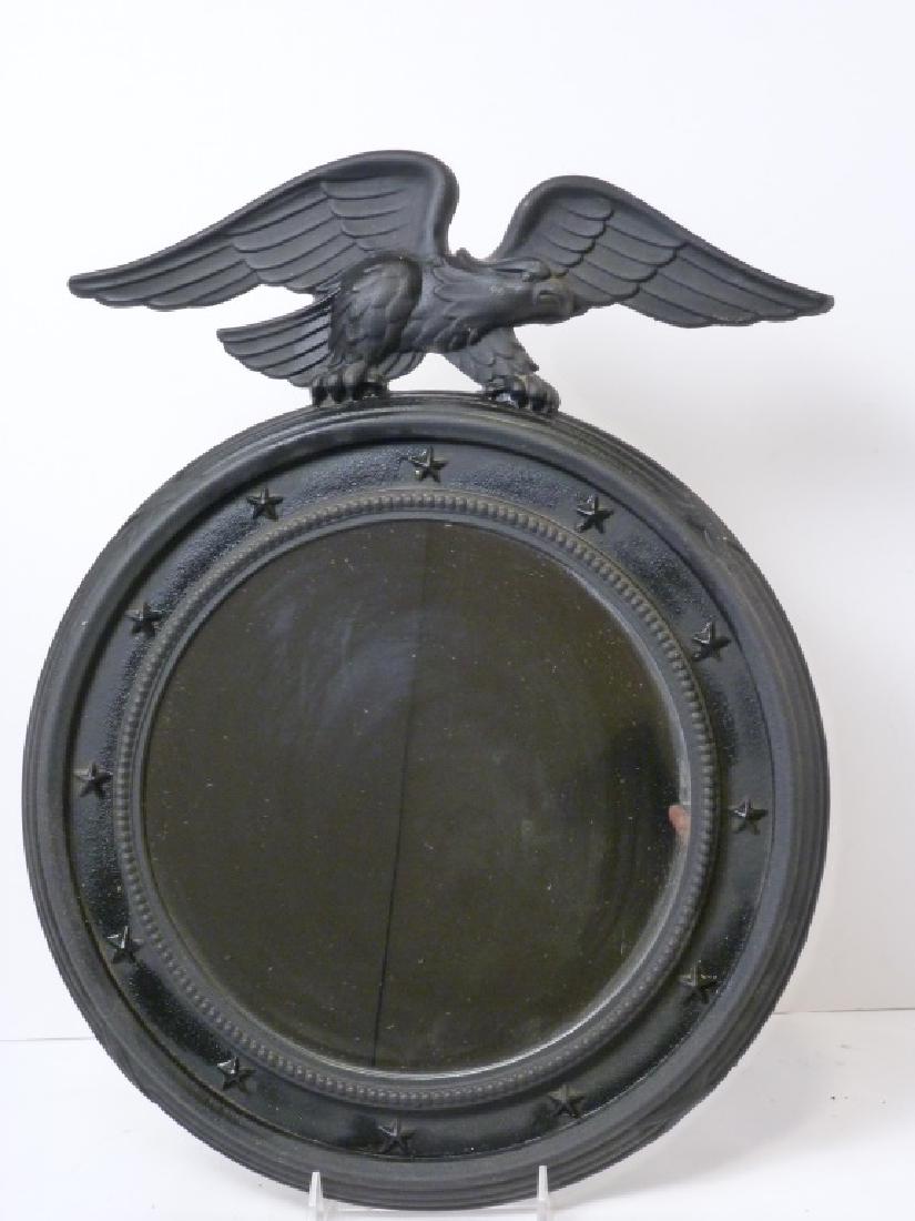 Cast Iron Eagle Mounted Atop an Oval Mirror: 17.5 inches high.