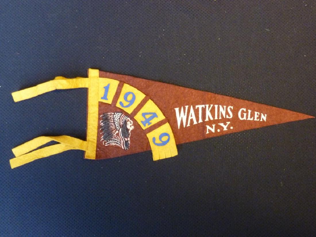Watkins Glen Penant 1949: Rust red and yellow with 1949 in blue. 5 h x 12 l inches.