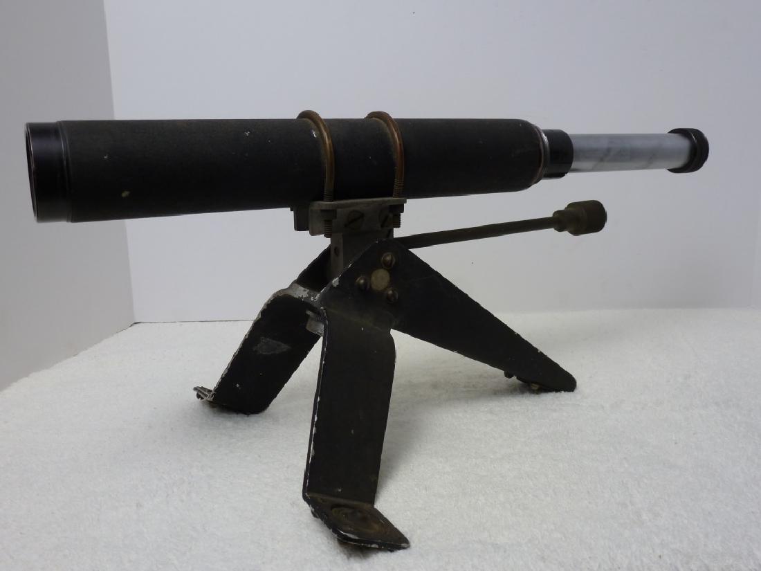 Mossberg Model A Spotting Scope: 9 h x 13 w x 12 d inches.