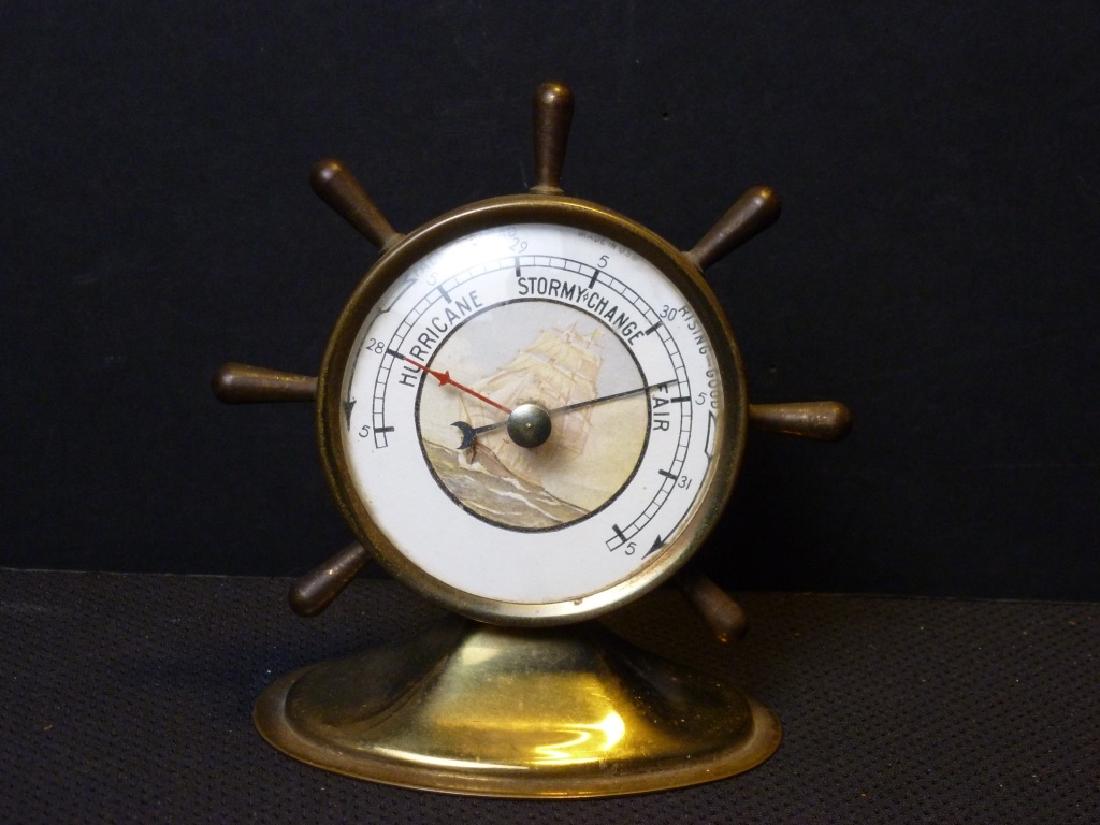 Ships Wheel Barometer Brass: 5 h x 4 w x 2.75 d inches.