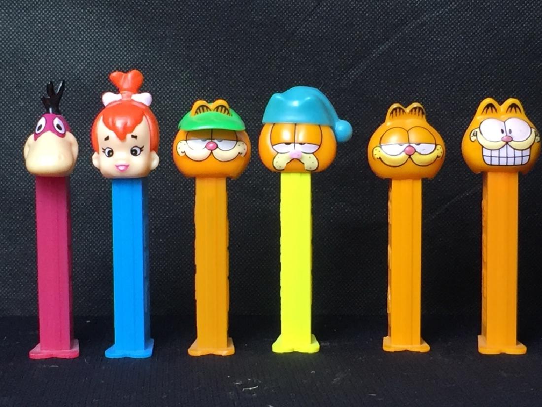 Pez Flintstones & Garfield: Dino and Pebbles Flintstone and (4) Garfield, all with feet. #Pez