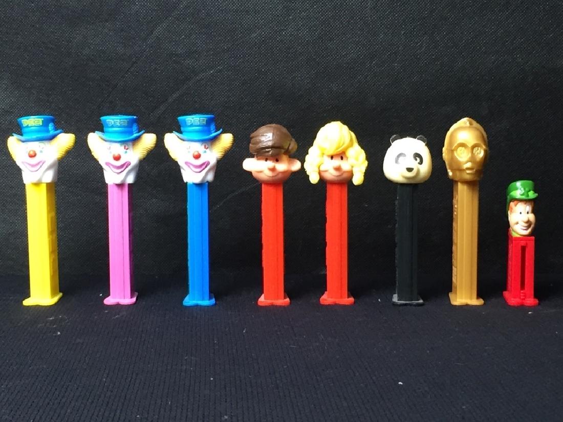Pez Miscellaneous Lot: (3) Clowns, boy and girl, panda, C3PO, and clown, all with feet. #Pez