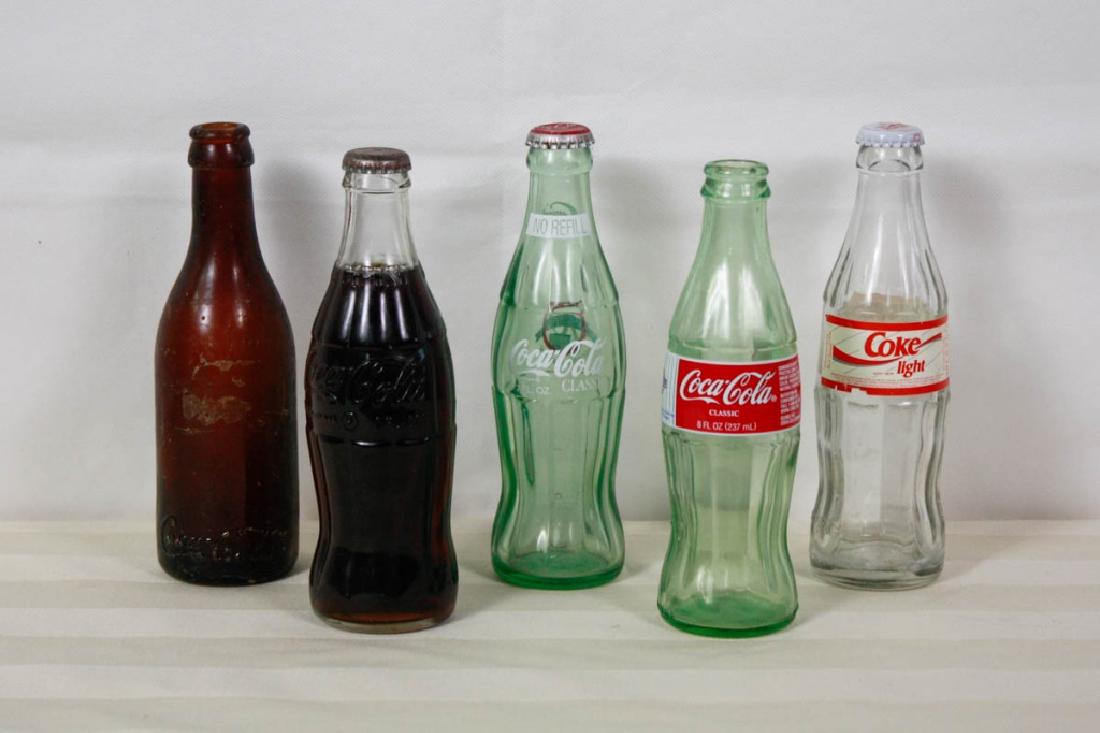 5 Coke Bottles: Including Coke lite 70th Anniversary; Yankees 100th anniversary; Brown Coca Cola bottle; Coke with coca-cola inside and dent in glass of bottle. #oldbottles #cocoacola #coke #vintageadvertising