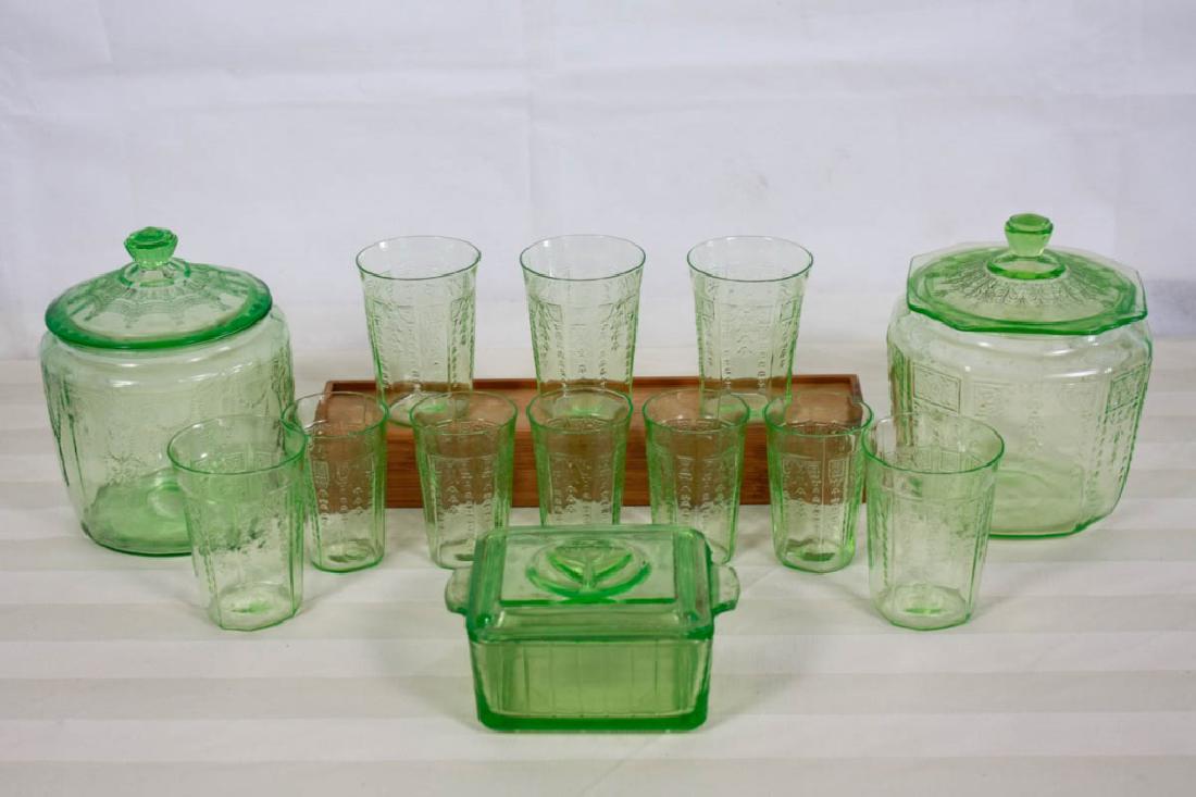 Light Green Depression Glass: Including 2 lidded jars, 1 small covered casserole, 5 medium glasses and 5 small glasses. Large jar is 7 H inches. #greenglass #depressionglass #vintageglass