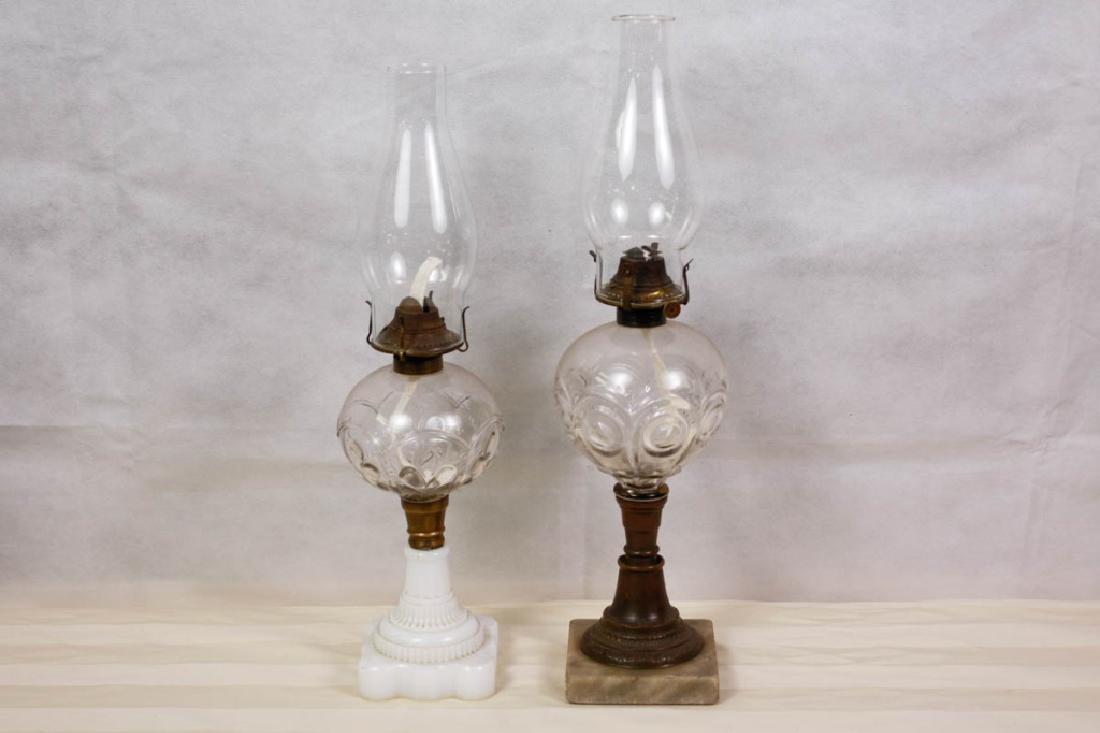 Flint Glass Kerosene Oil Lamps: One has a marble base and one milk glass base. 17.75 H - 19 H inches. #FlintGlass #HurricaneLamp #OilLamps #KeroseneLamp