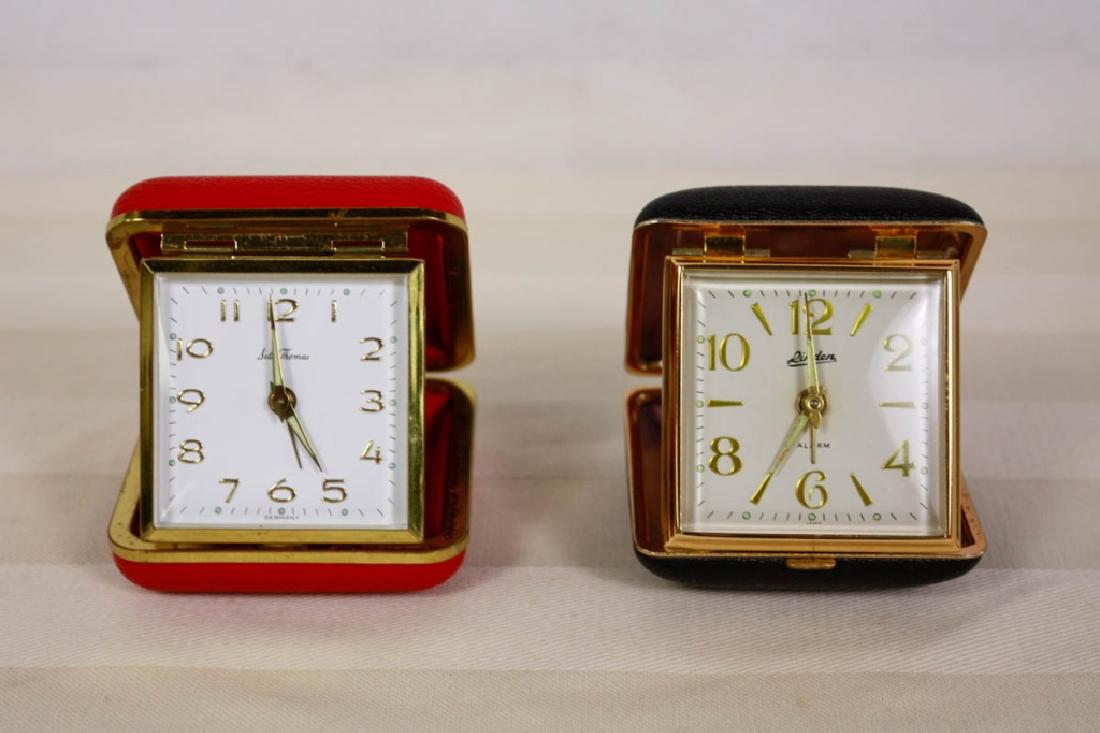 Travel Alarm Clocks Vintage (2): Linden (Japan) Black monogrammed CAA, travel alarm clock with instructions & Red Seth Thomas German wind-up alarm clock. Both 3 H x 3 W inches. Neither one works. #vintageclock #alarmclock