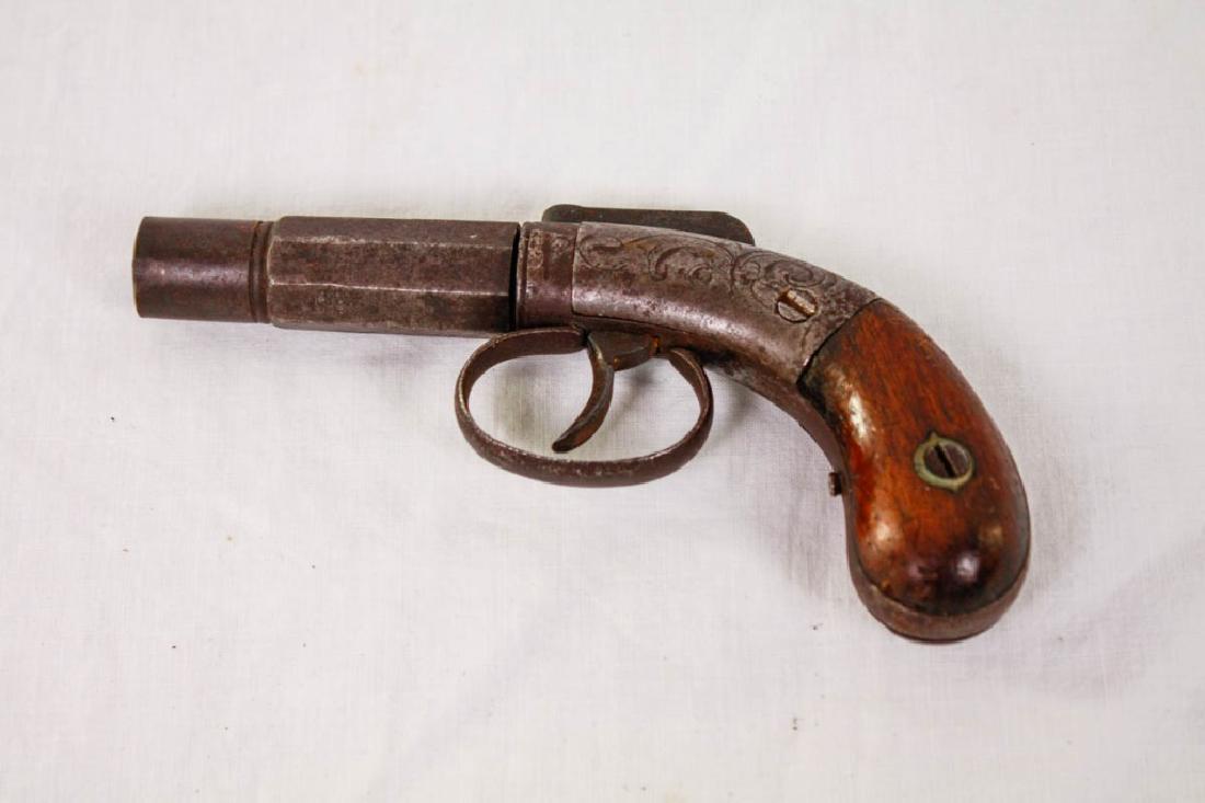 19th Century Derringer Pistol with Engraving: Second to thrid quarter of the 19th C. Marked: NY Cast Steel. 6 inches long. DISCLAIMER: All firearms are sold as collector's items only - we do not accept responsibility as to the shooting safety orr