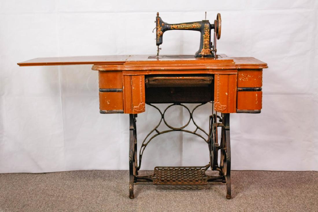 Standard Sewing Machine in Cabinet: Includes original instruction manual. 30h x 34.5w x 17d inches. Many layers of old paint. Good condition. #VintageFurniture #AntiqueFurniture #VintageSewing