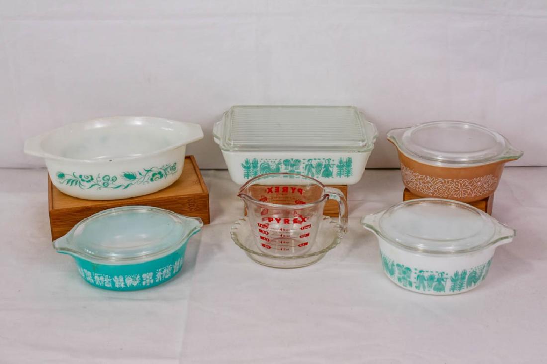 Vintage Pyrex Measuring Cup, Covered & Pie Dishes: 7 pieces including 3 small covered dishes, 2h x 8d inches; covered rectangle dish, 3h x 9.5w inches; oval dish, 3h x 10w inches; pie plate, 6d inches; measuring cup, 3.5h inches. All marked Pyrex. Pat