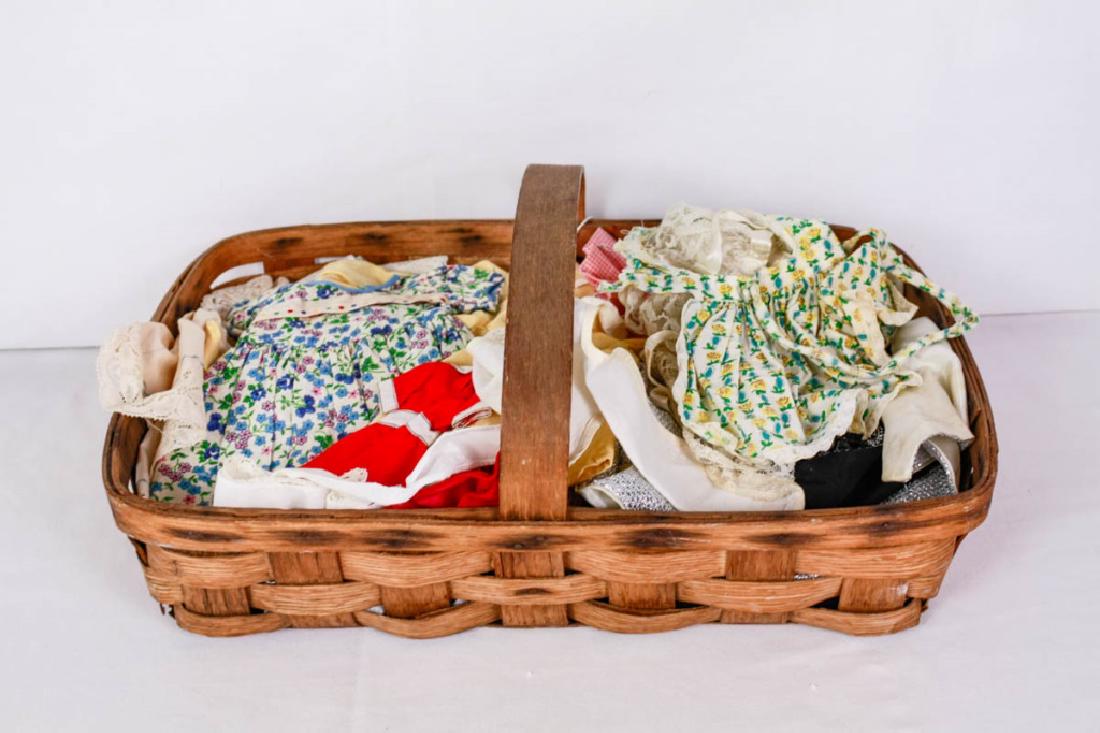 Basket of Various Doll Clothes: Basket, 4.25h x 20w x 13d inches. Vintage to modern. Fair to good condition. Fits dolls from about 6"-16" tall. Basket is antique with some wear. #VintageDoll