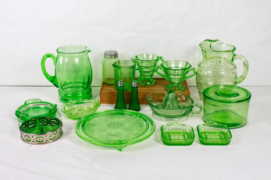 Depression & Other Green Glass Pieces: 16 pieces including (2) pitchers (8h & 8.25h inches); salt & pepper shakers; juicer; small pitcher; sugar & creamer; jar; (2) ashtrays; footed platter (10d inches); covered jar (4h x 6.25d inches); di