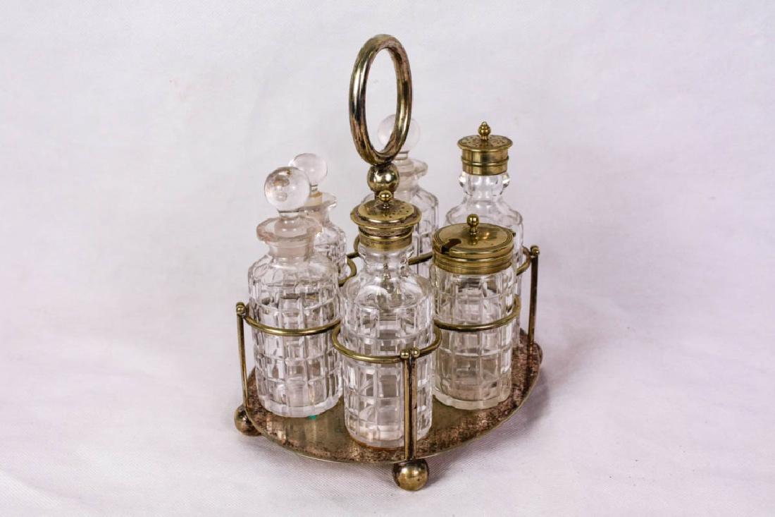 Walker & Hall Sheffield S.P. 5765 Cruet Set: Silver plate, includes 3 glass bottles with glass stoppers, salt, pepper and lidded bottle. Caddy marked "5765 Walker & Hall Sheffield, Warranted Silver Soldered, Askern Spa Hydropathic Company Limite