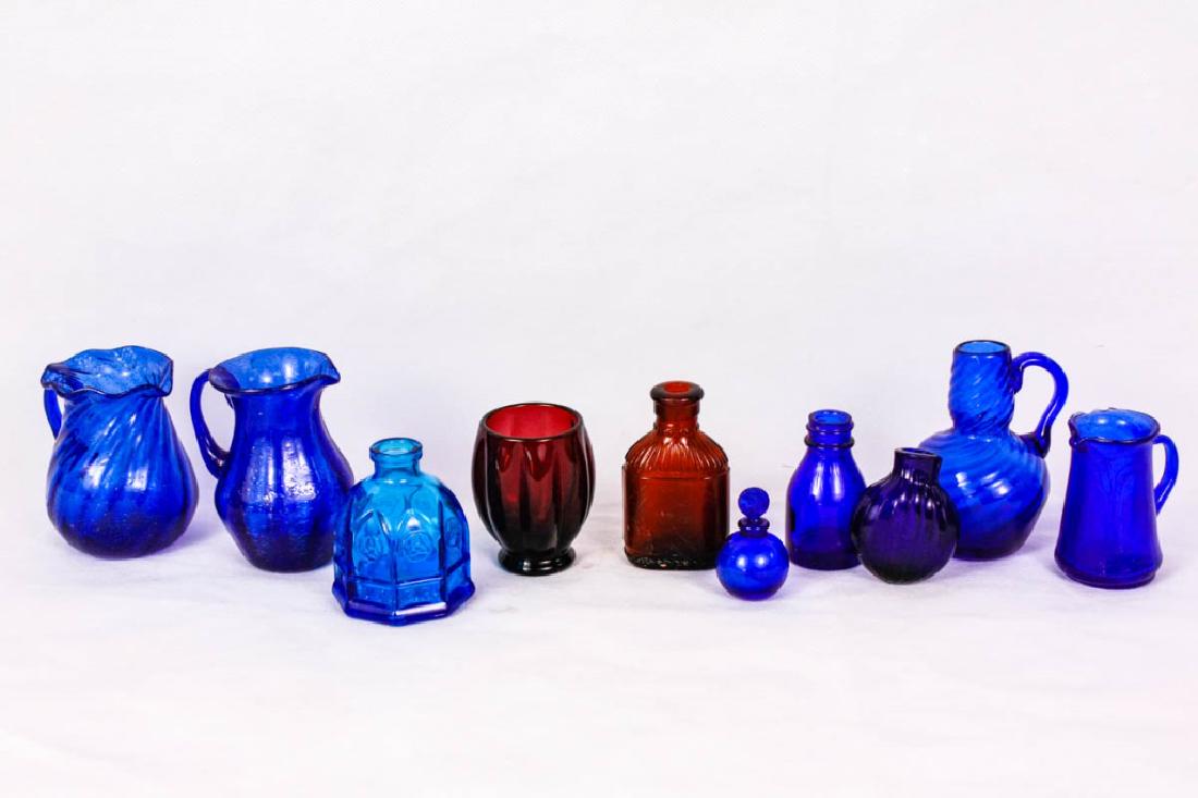 Collection of Vintage Glass Bottles & Pitchers: 10 pieces total. 2h - 3.75h inches. Some hand blown. (1) bottle marked Vicks. Octagonal bottle marked Carter, Wheaton, NJ. Chips to 1 pitcher. #VintageBottles #Vicks #BlueGlass #VintageGlass