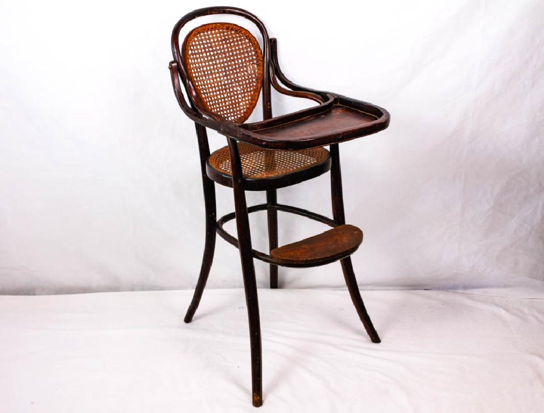 Caned Child's High Chair: 39h x 16.5w x 19d inches. Has wear. #ChildsChair #HighChair #VintageFurniture #AntiqueFurniture