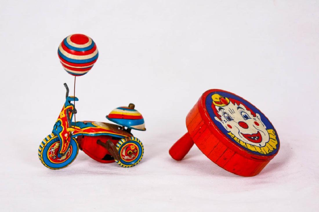 Vintage Metal Toys (2): Including Susuki TS-753 metal tricycle with balloon (bike, 4w inches, balloon, 5h inches) & Kirchof Newark, NJ metal clown noisemaker (2.75h x 3d inches). #Susuki #Kirchof #NewarkNJ #VintageToys #Meta