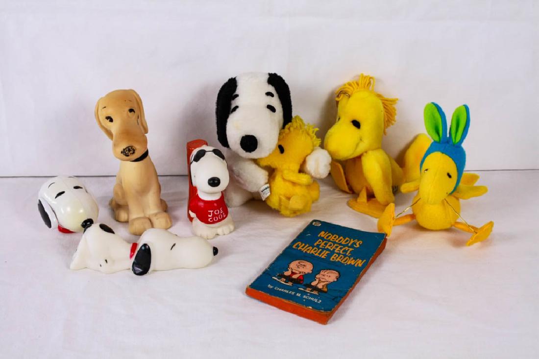 Collection of Snoopy & Woodstock Toys: 8 pieces including plush Snoopy & Woodstock, (2) plush Woodstocks, (3) squeak toys, plastic Snoopy head with rotating cartoon & Nobody's Perfect, Charlie Brown book of selected comics. #Snoopy #Woodst