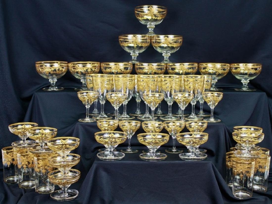 Gilt Glassware, 53 Pieces: 53 pieces total including (12) water glasses, (10) cordial glasses, (10) wine goblets, (10) champagne glasses, (10) compotes. Chip to at least 1 piece. Overall, very good condition. #Glassware #Vintag