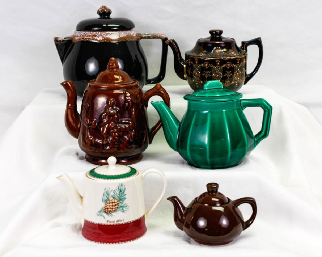 Collection of Vintage Teapots (6): 6 pieces total including brown drip ware teapot, 8h inches, marked York; Moriage redware Brown Betty teapot, 5.5h inches, illegibly marked; very old Brown Betty teapot, 7.5h inches, unmarked; green Ar