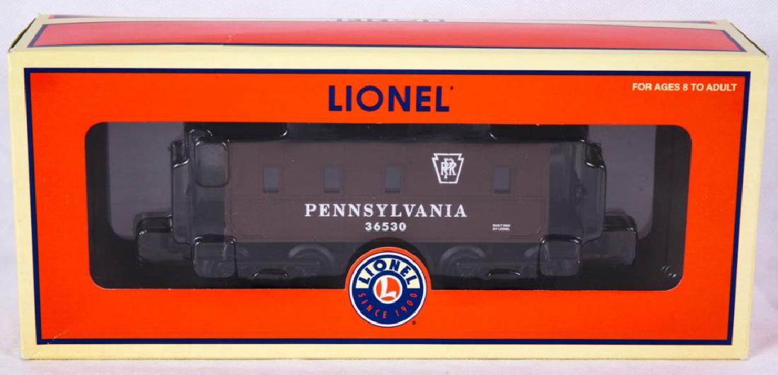 Lionel Pennsylvania Caboose 36530: 6-36530, 2004. Die-cast metal trucks, interior illumination, metal frame, tool boxes and smoke stack. Mint in box. #Lionel