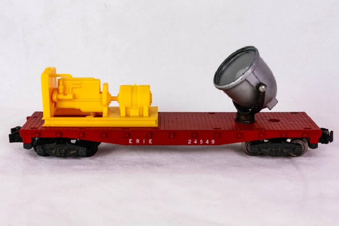 American Flyer 24549 Erie Spotlight Car: Black die-cast lamp bracket, silver lamp housing, yellow motor-generator. Good to Very Good condition. Marked American Flyer mfg by The AC Gilbert Co. #ACGilbert #AmericanFlyer