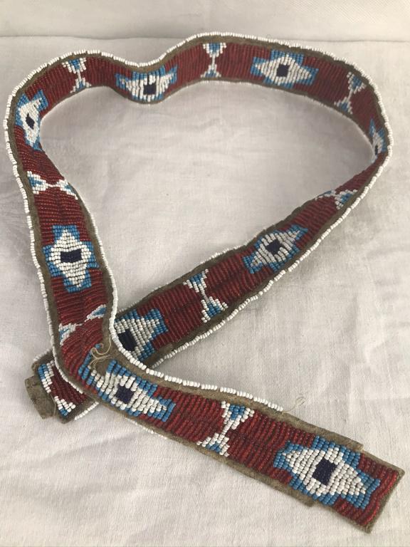 Brain Tanned Leather & Sinew Tied Strap/Belt: White, Red, Blue and navy colored beads. Damage to one small area - see photos 32 long x 1.5w inches.